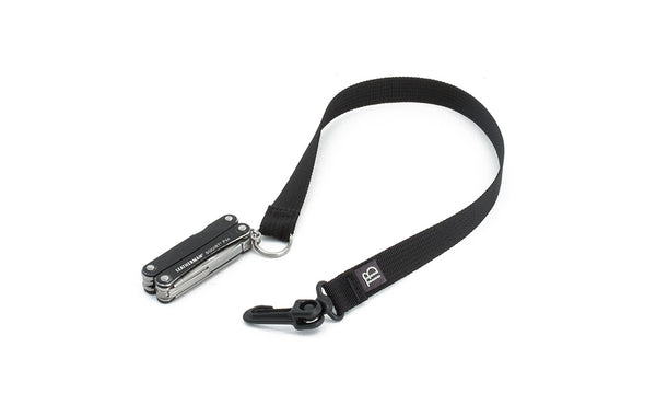 A 16-inch Black Key Strap with a snaphook at one end and a split-ring o-ring at the other with a pocket knife fed through the split-ring o-ring.